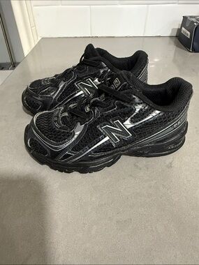 New Balance Kids Black Athletic Sneakers with Reflective Details